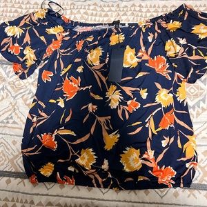 Cool and flowy women’s blouse floral print gently used.